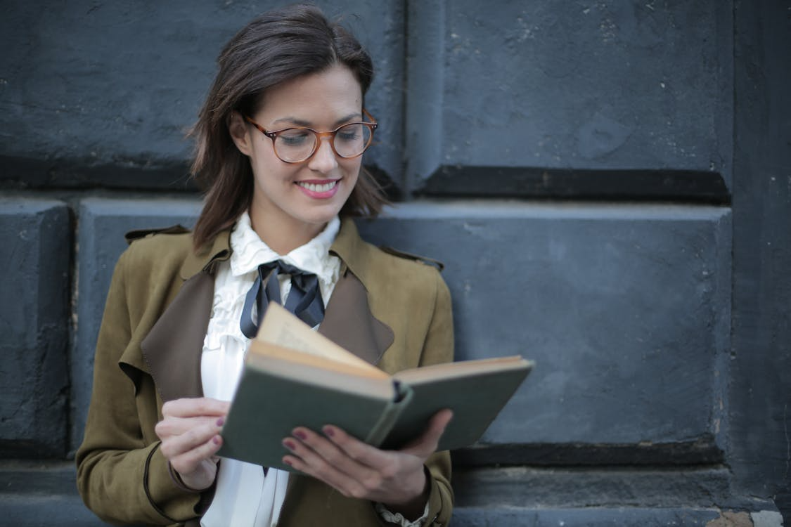 a woman holding a book