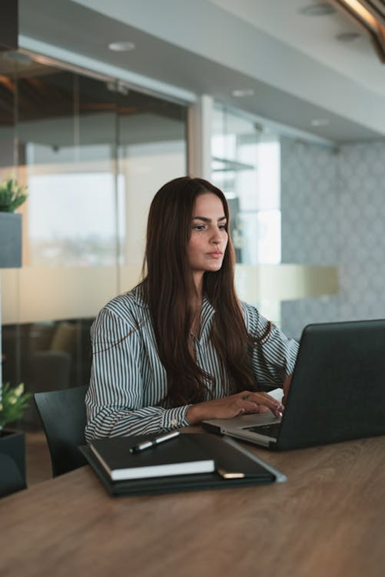a woman working at her desk