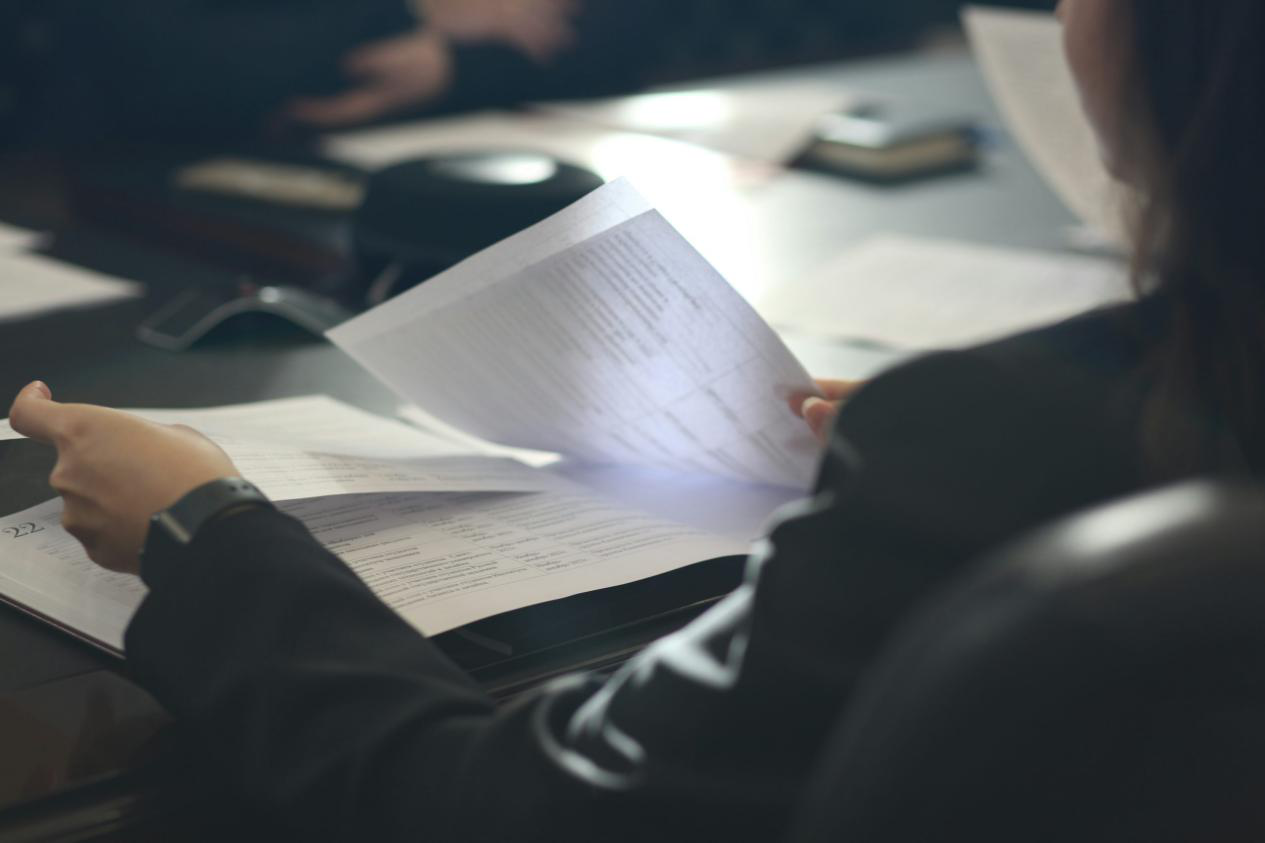  Woman reviewing translated documents at a desk