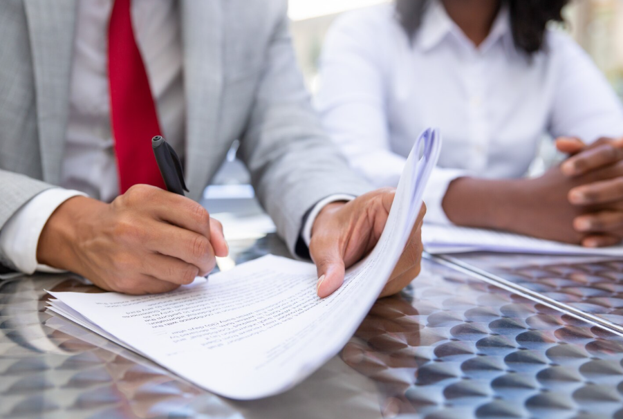 Person signing humanitarian visa documents supported by sworn translated police records