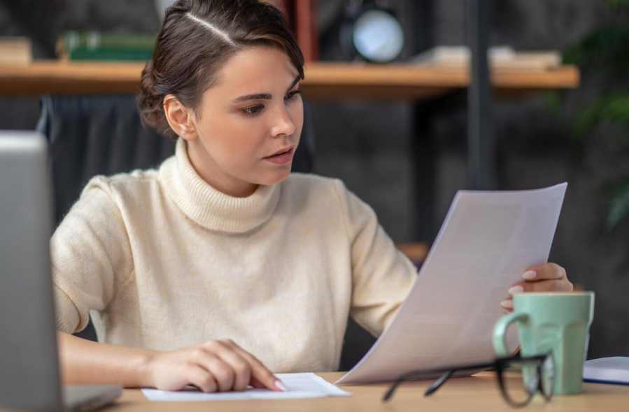 Professional translator reviewing an enrollment letter translation for accuracy and consistency